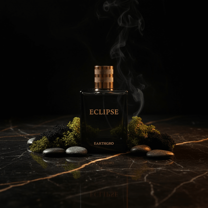 ECLIPSE mens fragrance by Max Millies displayed elegantly with stones and moss on a dark marble background.